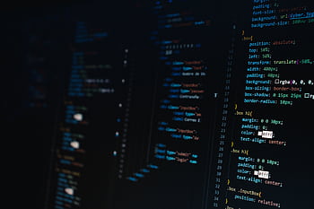 Detailed view of HTML and CSS code on a dark screen, representing modern web development. HD wallpaper