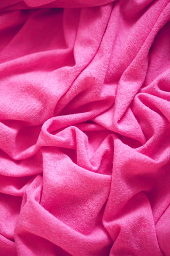 A close-up of soft, wrinkled pink fabric, showcasing texture and softness. HD phone wallpaper