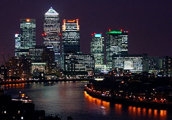 Beautiful nighttime view of Canary Wharf, London, with reflections on the River Thames. HD wallpaper
