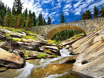 Mountain bridge, river, creek, peaceful, stone bridge, nice, trees, beautiful, rocks, stones, mountain, summer, bridge, clouds, nature, sky, lovely, calmness, stream HD wallpaper