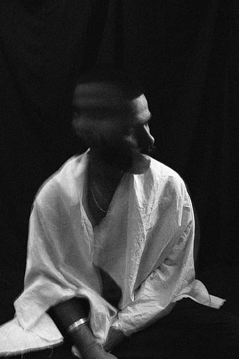 Black and white of a young man with motion blur, evoking deep emotions. HD phone wallpaper