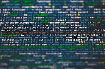 Detailed view of colorful programming code on a computer screen. HD wallpaper